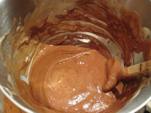 Folding the egg and chocolate mixtures together. Folding the egg and chocolate mixtures together.