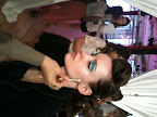 White kohl eyeliner was drawn along the top lid to open up the eyes, and a dramatic whoosh of mint green and blue shadow was applied in a boxy, wavy shape from the inner corner, ending in a winged tail.