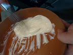 Steve then whisks his dressing before adding the fruit to the bowl.