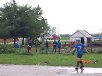 WACO Students and other volunteers help to clean up damage at 1367 111th Street in Henry County