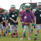 Youngsters wait their turn at hitting sliothars at Camp Ciaran at the Shamocks GAA Club recently (Pic Howard Crowdy)