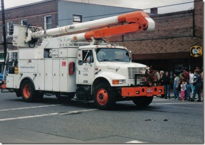 12 Portland General Electric 1989-2001 International 4700-Series Line Truck in the Rainier Days in the Park Parade on July 11, 1998