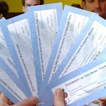 At the vegetarian restaurant, flaunting our free tickets!