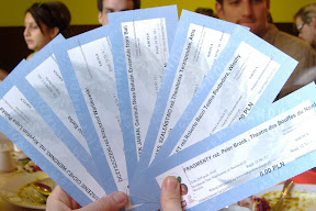 At the vegetarian restaurant, flaunting our free tickets!