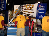 Students working on fixing the robot