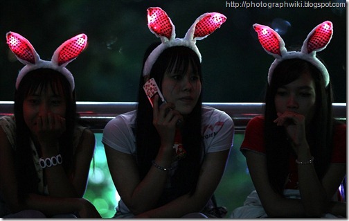 Three women, who wore illuminated bunny ears to get into the spirit