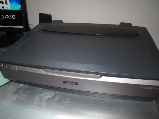 I'll just wait for our Epson 10000XL scanner to warm up.