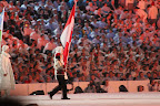 Joannie Rochette carrying in the Canadian flag