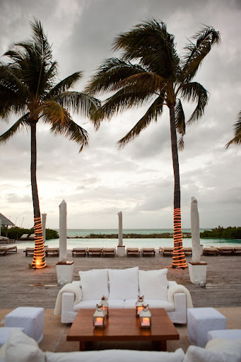 White lounge furniture offered cozy areas for guests to relax as the evening progressed. White lounge furniture offered cozy areas for guests to relax as the evening progressed.