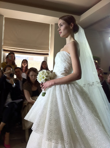 I loved this eyelet tiered strapless gown in ivory organza with a taffeta ribbon.