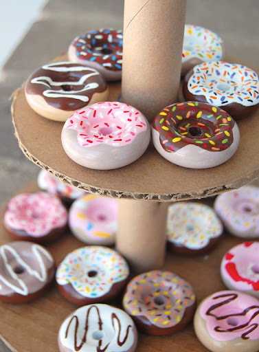 ....these homemade wooden donuts!!! She used unfinished wooden wheels and painted them with her daughters.