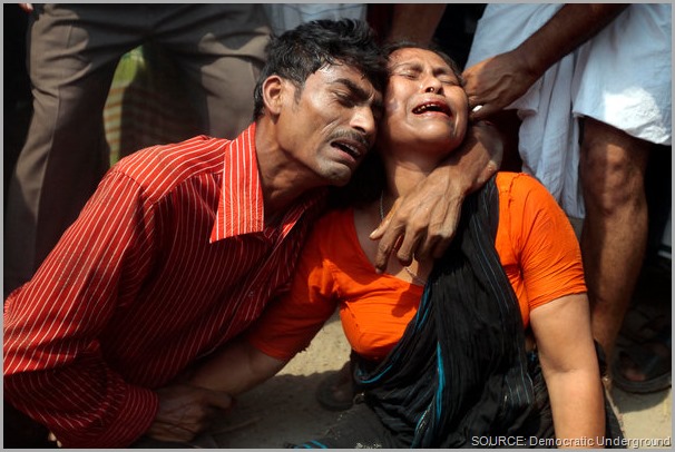A family mourns the death of a loved one in the Rana Plaza collapse. Take a stand! Share this post and CLICK to visit the Worker Rights Consortium site to get more information.