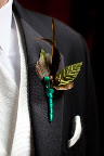 Jamie wore a feather boutonniere.