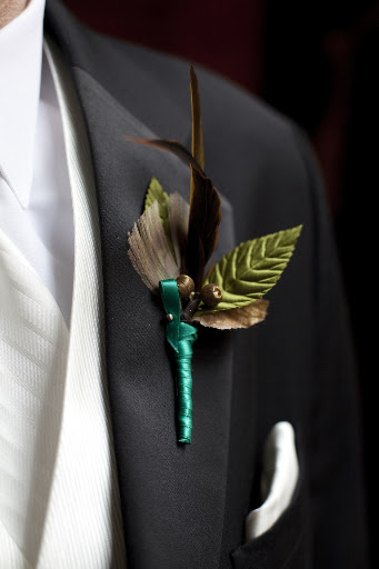 Jamie wore a feather boutonniere.