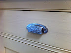 For the drawers, I used a unique chrome bin pull.