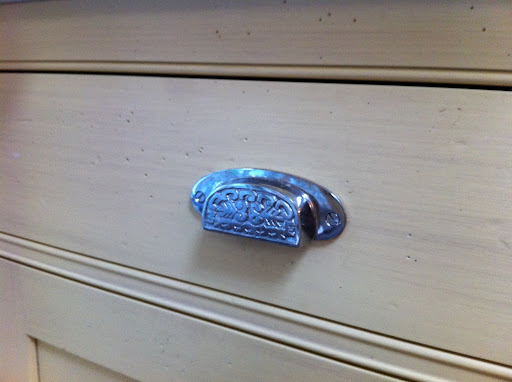 For the drawers, I used a unique chrome bin pull.