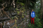 Taking shelter from the rain under the sloping Chachapoya walls, Perquilla, Gran Vilaya Trek, Chachapoyas Region, Peru