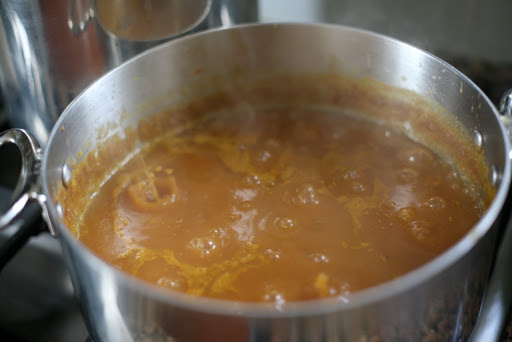 Bring the mixture of pumpkin, apple cider, and spices to a boil.