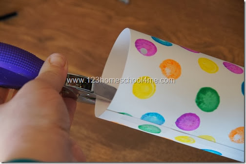 us a hole punch to make two holes across from each other on one end of cylinder us a hole punch to make two holes across from each other on one end of cylinder