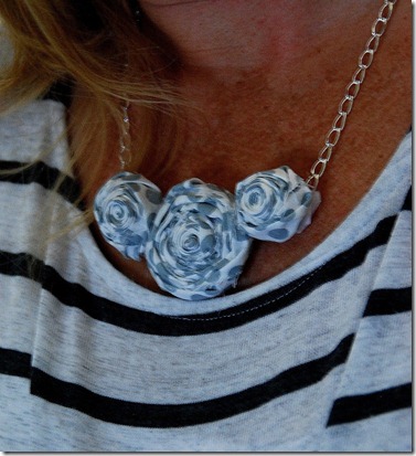 rolled flower necklace on
