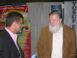 Sh. Yusuf Estes @ his booth in the bazaar