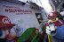 In this photo distributed by Nintendo of America, Eduardo O. of Manhattan, N.Y.,  tweets to get a slice of Mario’s favorite mushroom pizza at the launch event in Times Square on Nov. 12, 2011. Consumers shared their excitement for the new game by tweeting a special hashtag in exchange for a free slice of pizza in celebration of the Nov. 13, 2011 launch of Super Mario 3D Land for Nintendo 3DS.