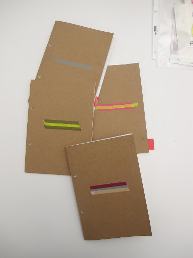 Ayesha labels her notebooks with washi tapes in different colored stripes.