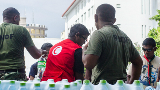 Residents of Male are receiving bottled and desalinated water provided by neighboring countries via public taps and mobile vehicles, on 8 December 2014. The tiny island nation entered its fifth day without drinking water as the government scrambled to repair a major desalination plant after a crippling fire. Photo: Minivan News
