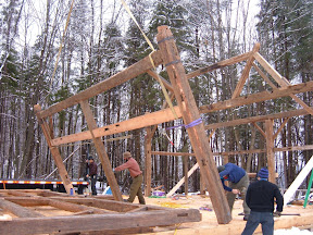 The thrid bent is lifted into position.  The trussed bent can be seen in the background.