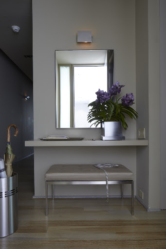 I needed a smaller size mirror for my entryway to fit the space between the sconce and floating shelf and found a great option with the Infinity mirror from Room & Board (roomandboard.com)