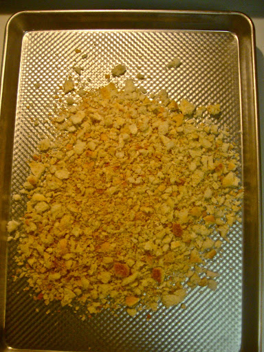 Toast breadcrumbs in a 300 degree oven until they're slightly browned and crunchy.