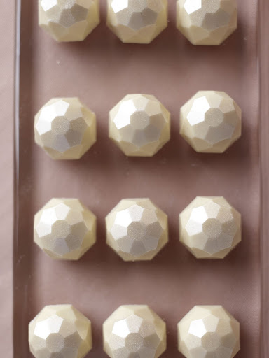 Brushed with edible luster dust, these amazing multifaceted lustrous chocolate nuggets are almost too beautiful to bite into. (Martha Stewart Weddings) Brushed with edible luster dust, these amazing multifaceted lustrous chocolate nuggets are almost too beautiful to bite into. (Martha Stewart Weddings)