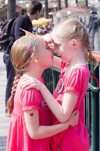 Sophie and Elise measuring heights 2