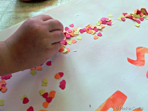 add punched paper confetti