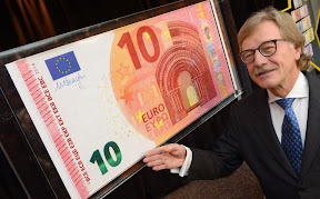 epa04018522 Yves Mersch, member of the Executive Board of the European Central Bank (ECB), presents the new 10 euro banknote in the ECB headquarters in Frankfurt Main, Germany, 13 January 2014. The new banknotes will come into effect on 23 September 2014.  EPA/ARNE DEDERT