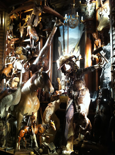 This window had animals carved in wood, taxidermy, leather, and feathers.