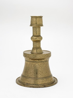 Candlestick | Origin:  Turkey | Period: late 15th-early 16th century  Ottoman period | Details:  Not Available | Type: Brass | Size: H: 26.0  W: 17.1  cm | Museum Code: F1980.19 | Photograph and description taken from Freer and the Sackler (Smithsonian) Museums.