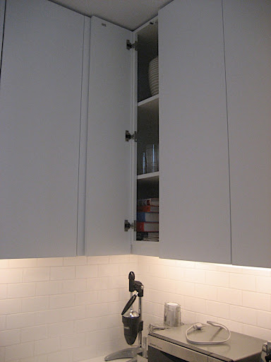 The kitchen has under cabinet lighting as well as some recessed lighting overhead.