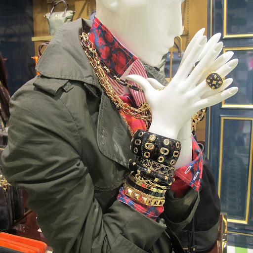 This mannequin is not holding back with her accessories, and I love it.