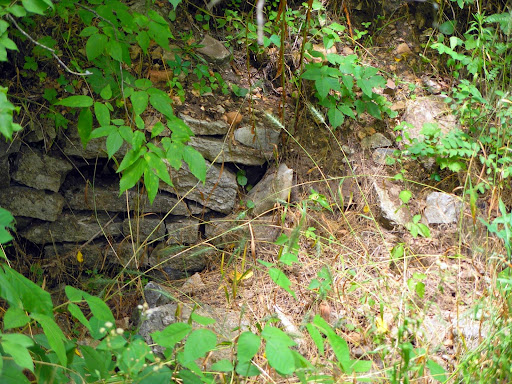 The remains of a stone wall where the Gibson home once stood. (Photo credit: Jeremy Shreckhise)
