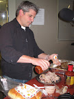 John Stage, owner and pit master of Dinosaur Bar-B-Que, getting ready to serve up some delicious pork. John Stage, owner and pit master of Dinosaur Bar-B-Que, getting ready to serve up some delicious pork.