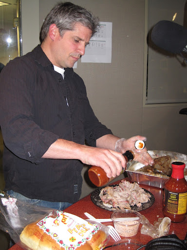 John Stage, owner and pit master of Dinosaur Bar-B-Que, getting ready to serve up some delicious pork. John Stage, owner and pit master of Dinosaur Bar-B-Que, getting ready to serve up some delicious pork.