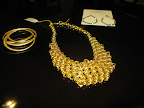 Bracelets from Alexis Bittar and earrings from Amarita Singh.