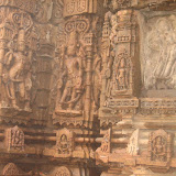 This is a Shiva temple and we have not seen any Shiva image till now, strange isn't it. However here we see two Shiva images, almost in similar postures. In left side image, Shiva is shown with four hands, carrying trishula, snake and a kamandalu. One hand is in varada posture. In right side image, he is carrying a parasu and danda.