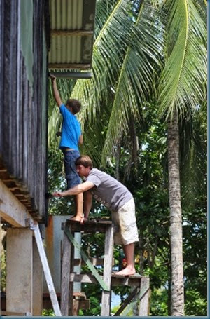 Brennen & Benjamin painting the house