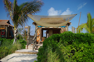 Looking up at a Cabana from the path to the beach.