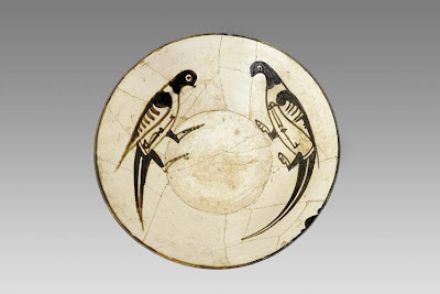 Bowl | Origin:  Iran or Uzbekistan | Period: 10th century  Samanid period | Details:  The facing birds on this bowlÂ—one of the most popular motifs on Persian ceramics of the ninth and tenth centuriesÂ—conceal the Arabic word "blessing" on their undersides. They can be regarded as the first zoomorphic inscriptions and indicate the secular use of these ceramic wares. | Type: Earthenware painted under glaze | Size: H: 6.6  W: 21.8  cm | Museum Code: F1956.1 | Photograph and description taken from Freer and the Sackler (Smithsonian) Museums.