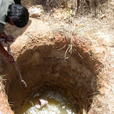 Drawing water from a hand dug well
