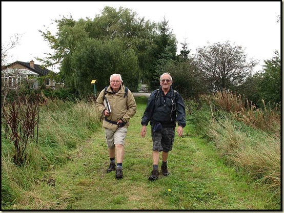 Reg and John plod on towards Little Woolden Moss