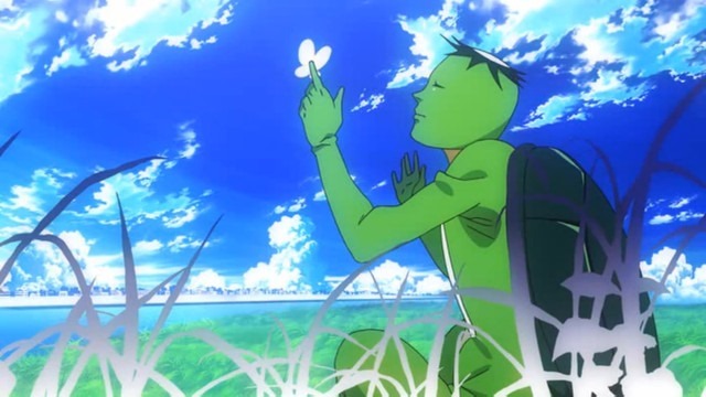 A grown man in a kappa suit sits in the grass on a bright blue-sky day letting a butterfly land on his extended index finger